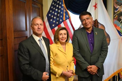 Speaker Pelosi poses for a photo