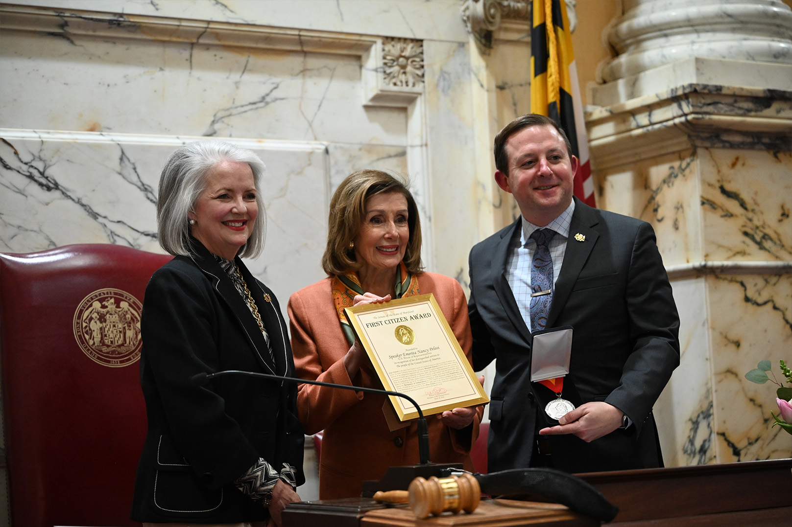 Speaker Pelosi poses for a photo