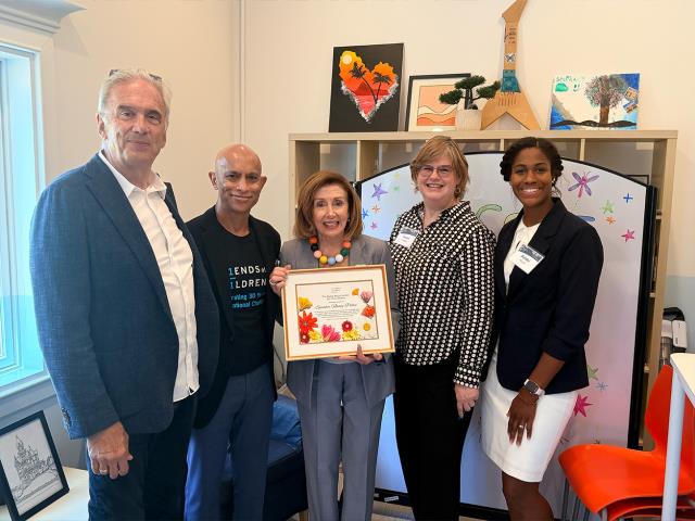 Speaker Pelosi poses for a photo
