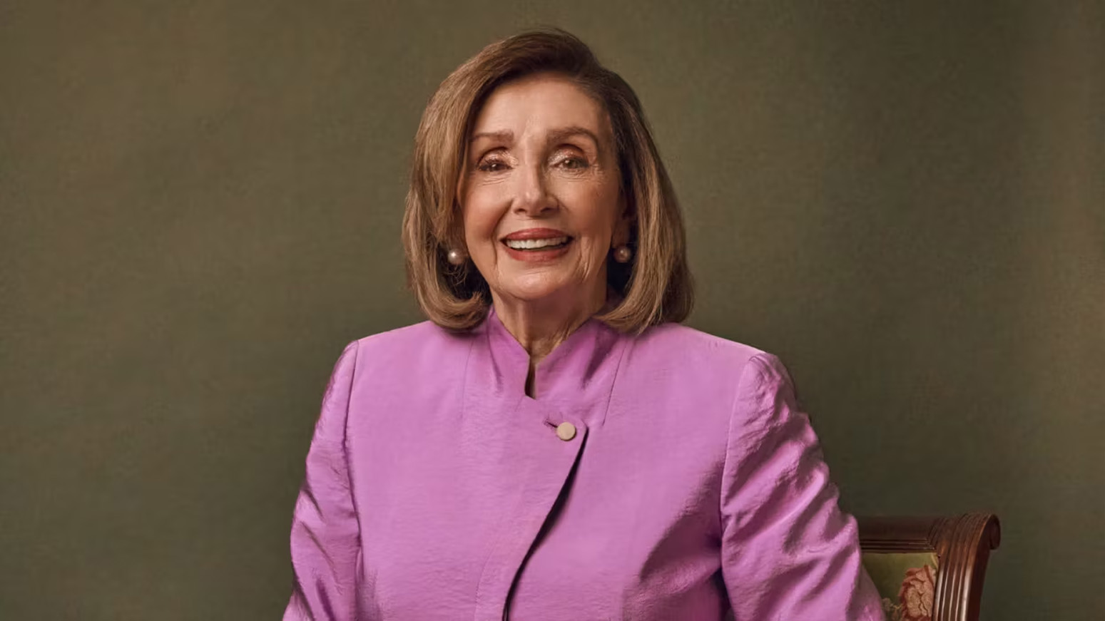 Speaker Pelosi poses for a photo