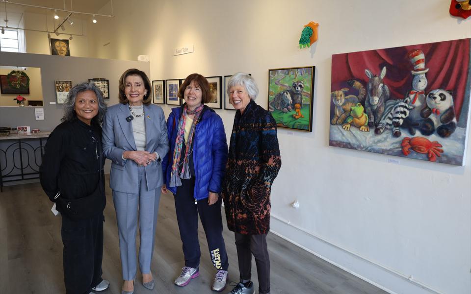 Speaker Pelosi poses for a photo