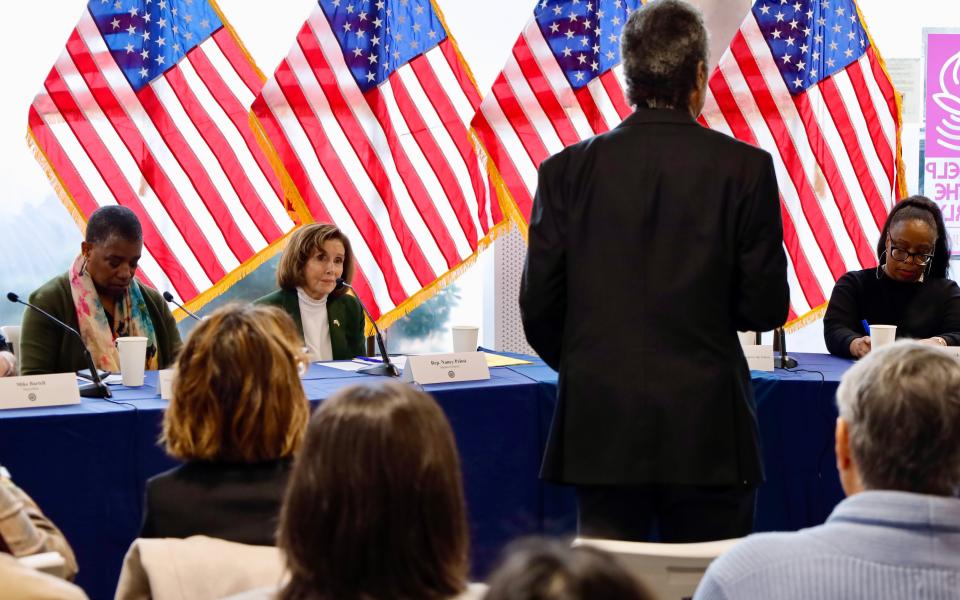 Speaker Emerita Pelosi listening to a constituent