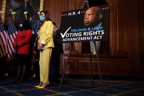 Speaker Pelosi poses for a photo