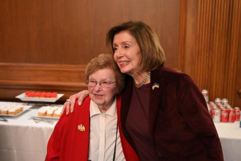 Speaker Pelosi poses for a photo
