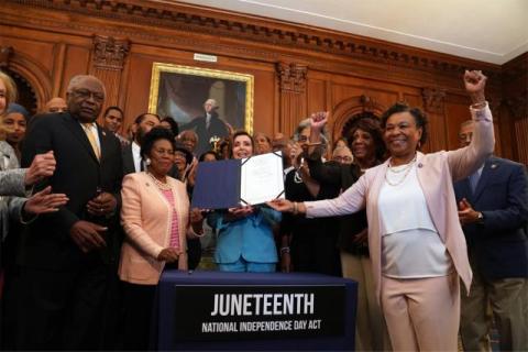 Speaker Pelosi poses for a photo