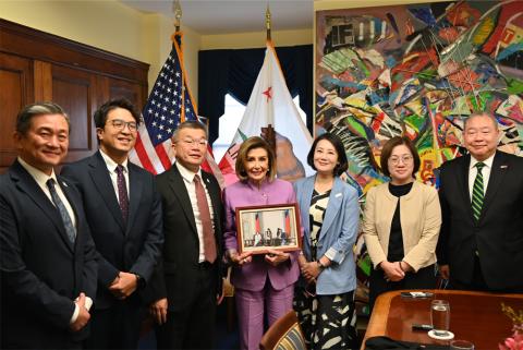Speaker Pelosi poses for a photo