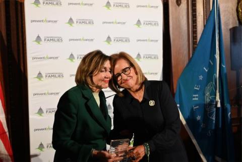 Speaker Pelosi poses for a photo