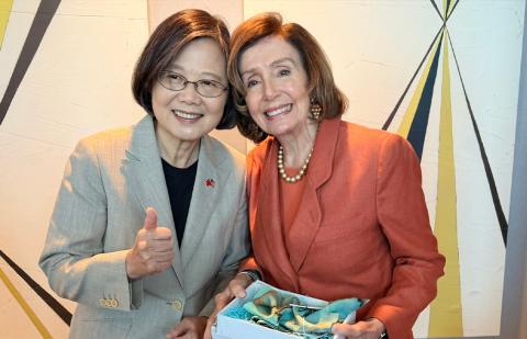 Speaker Pelosi poses for a photo
