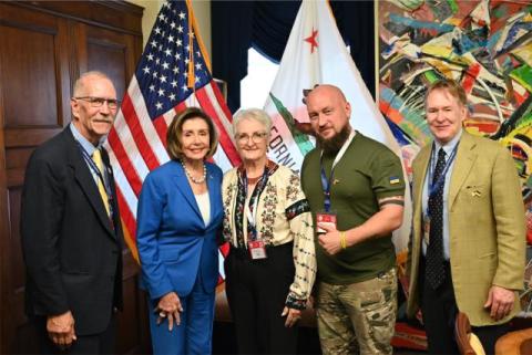 Speaker Pelosi poses for a photo