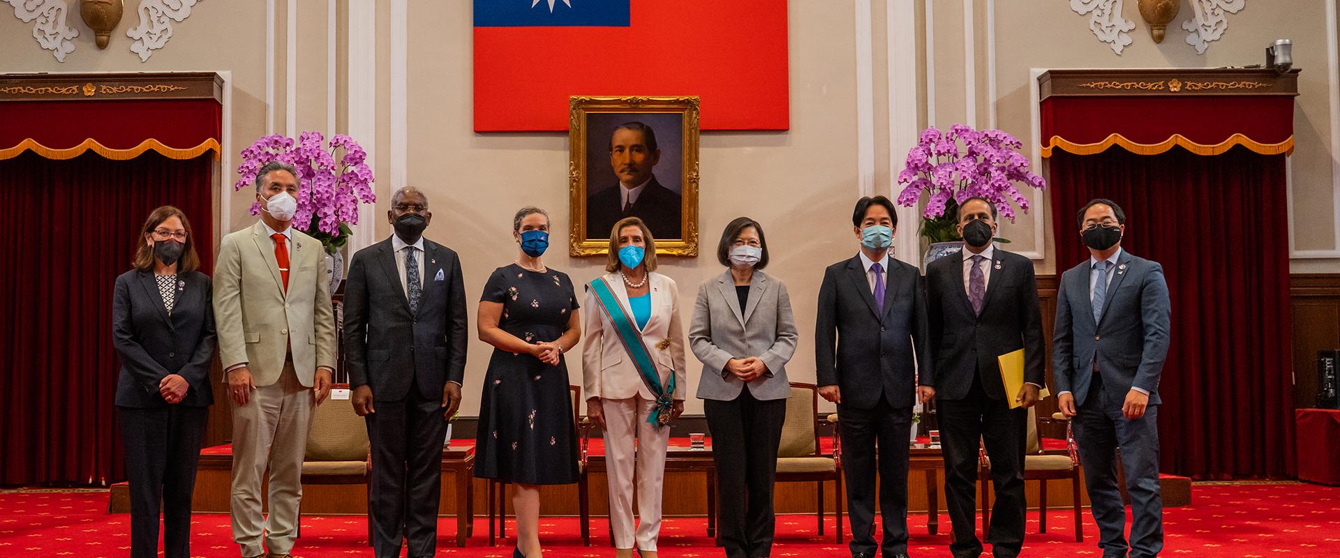 Speaker Pelosi's congressional delegation to Taiwan stands for a group photo with President Tsai