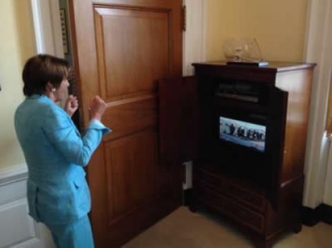 Congresswoman Nancy Pelosi celebrates Oracle Team USA's stunning comeback win at the 34th annual America's Cup from her office in the United States Capitol.